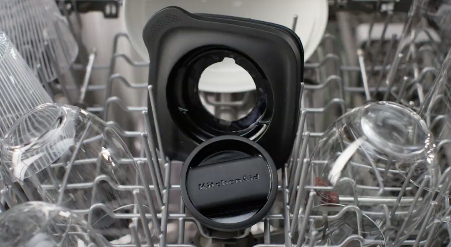 Black KitchenAid® blender lid and top on dishwasher rack Black KitchenAid® blender lid and top on dishwasher rack